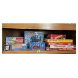 Shelf of board games, Twister, Operation,