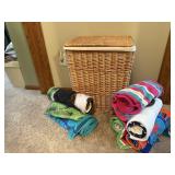 Wicker hamper, beach towels