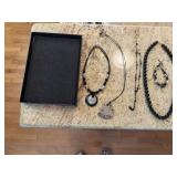 Black costume, beaded jewelry