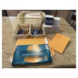 Basket of office supplies, notepads, envelopes,