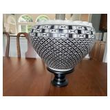 Artisan pottery piece on pedestal