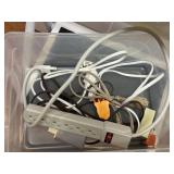 Tote of surge protectors, extension cords