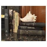 Book collection, conch shell