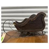 Decorative sleigh, greenery