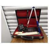 Briefcase, calculators, slide ruler, bank bag