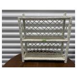 White wicker wall shelf