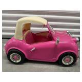 OG Girl riding toy car