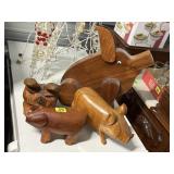 Wood carved pigs (4)