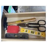 Contents of tool drawer, hammer, levels, snips