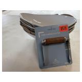 Wire cheese slicer, white oval bowls