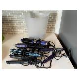 Basket of curling irons, hair straighteners