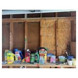 Shelf of gardening supplies, flower pots,
