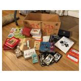 Box of playing cards, score cards, dice