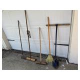 Brooms, post hole digger, scraper