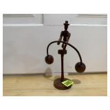 Tightrope walker carving