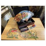 Hand fans, paper village cards, shoe pin cushion