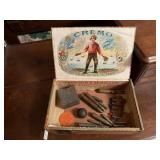 Cigar box of ammunition shells, medal