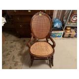 Caned hip hugger rocking chair