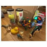 Box of toys, tennis balls, rubber duck, Simon Says