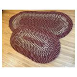 Red oblong braided rugs (2)