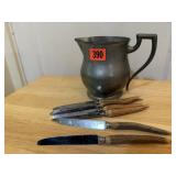 Pewter pitcher, steak knives