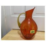 Orange blown glass pitcher