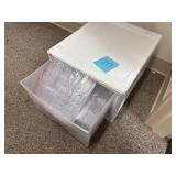 Tote full of plastic forks, knives, spoons