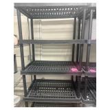 Tall black plastic shelf