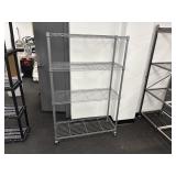 Four tier wire shelving unit, with wheels