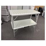 Coleman adjustable height, two tier table/shelf.