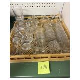 Plastic dish rack full of misc. glasses and cups