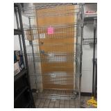 Large metal wire rack on wheels