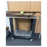 Wood work cart on wheels w/ stack of pizza boxes
