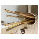 Bucket of wooden baseball bats
