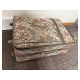 Suitcase of bedding, blankets