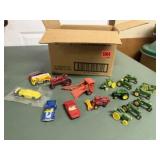 Toy tractors, cars, fire trucks