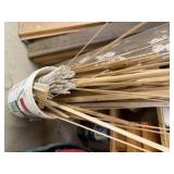 Bucket of wooden dowels, scraps