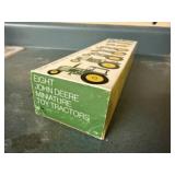 Boxed set of 8 miniature John Deere toy tractors