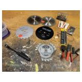 Saw blades, pen light, files, utility knife blades