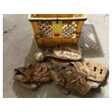 Crate of baseball gloves
