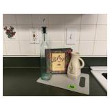 Cutting board, oil bottle, recipe book, pitcher