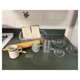 Recipe book, rolling pin, creamer, measuring cups,