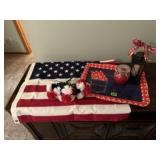 American flag, picnic tray, candle, flowers