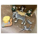 Lion puzzle, cat garden stakes, Monopoly man