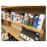 Shelf of spray paint, stains, consumables