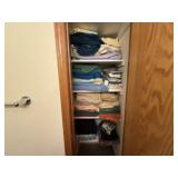 Contents of linen closet, bedding, bath towels