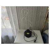 Flamingo lampneeds cleaning or repair, as it