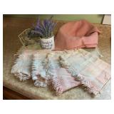 Pastel woven place mats, basket, napkin holder,