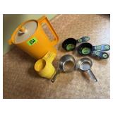 Tupperware beverage pitcher, measuring cups