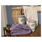 Basket, bath towels, soap dispenser, toothbrush